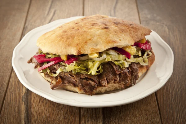 Doner Kebab - grilled meat, bread and vegetables shawarma sandwich