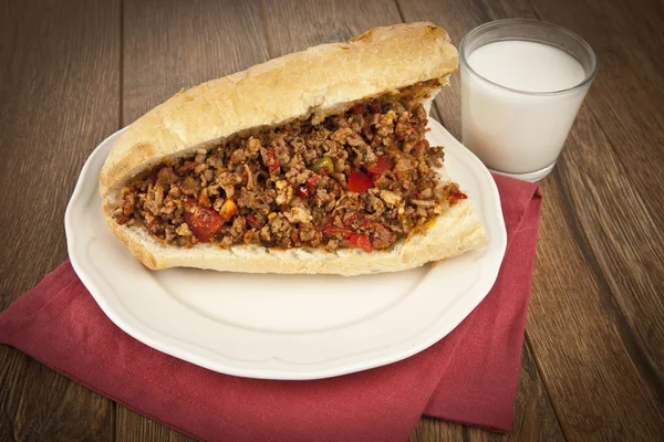 Turkish Kokorec - lamb intestine food sandwich with ayran