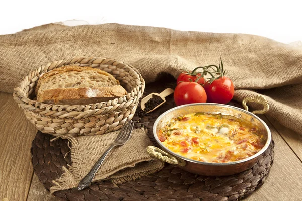 Menemen Turkish breakfast food egg, tomatoes and pepper in pan