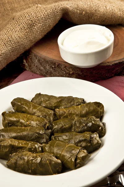 Dolma, stuffed grape leaves in a bowl, turkish and greek cuisine