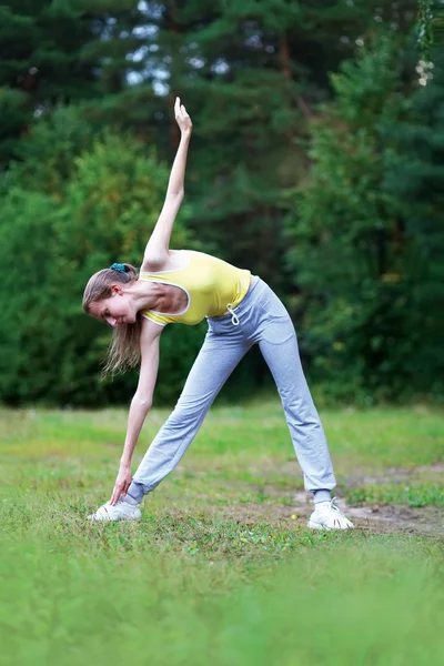 Fitness, sport, exercise concept - woman doing exercises in fore