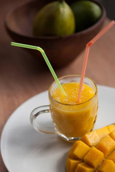 The glass of fresh mango smoothie