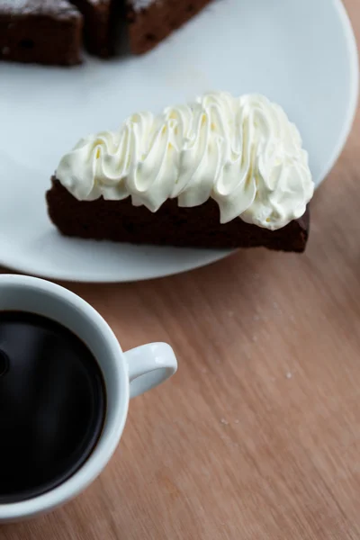 Closeup of piece of chocolate cake with a cream