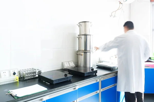 Researcher working in chemistry laboratory