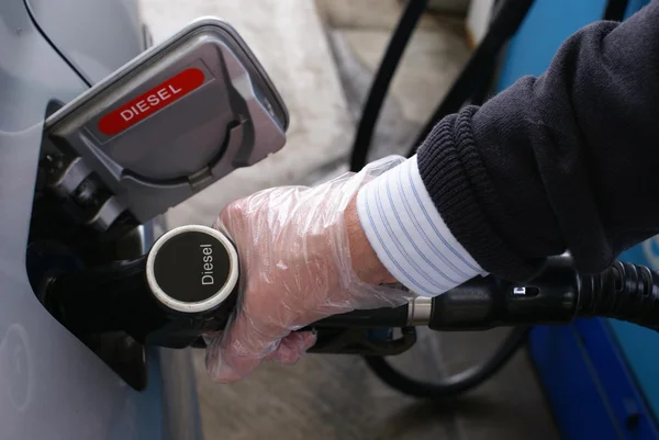 Refueling a car with diesel or petrol