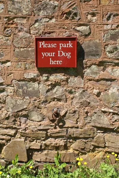 Please park your dog here sign.