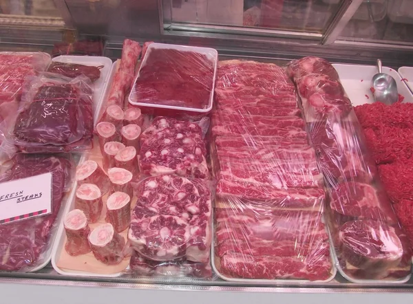 Fresh meat display in a showcase refrigerator for butchery market