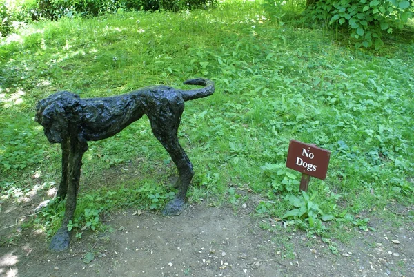 No dogs sign.  dog statue