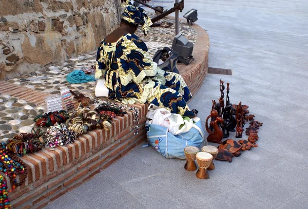 Street seller selling African ornaments and jewellery