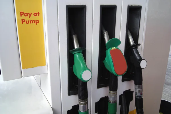 Fuel dispensing nozzles in a petrol station