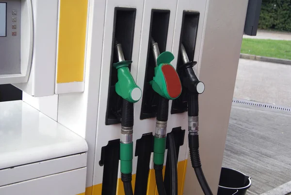 Fuel dispensing nozzles in a petrol station