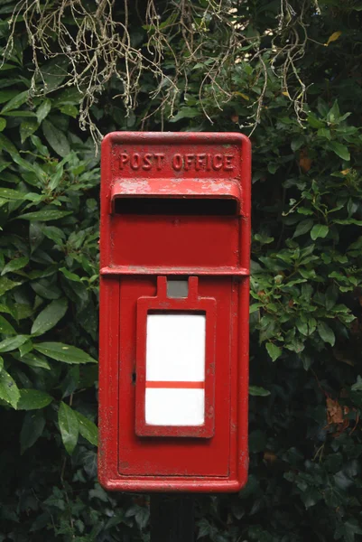 Red British post office mail box. Red British lamp post box