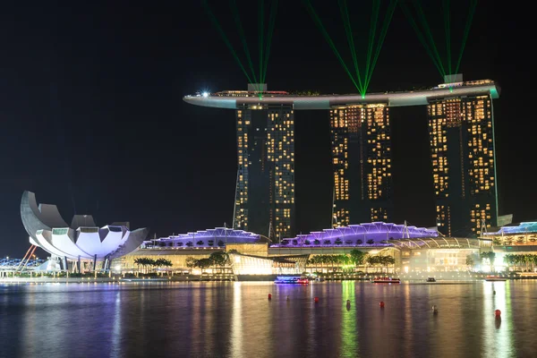 Marina Bay Sands hotel at night with light and laser show in Singapore
