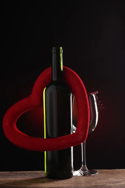 St Valentine\'s setting with present and red wine