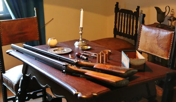 Armory with guns on the table