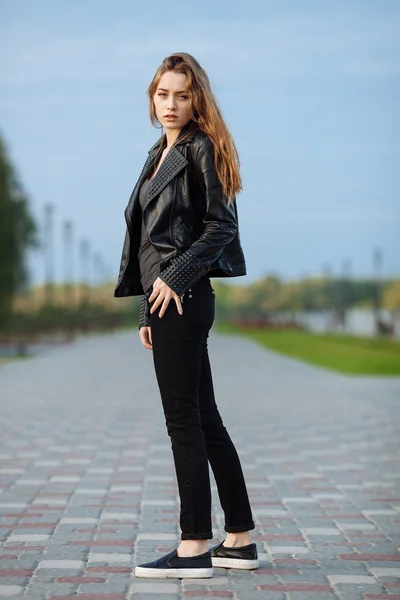 liberal Ja Mappe Happy young beautiful woman in black leather jacket black jeans slip-on  posing for model tests in the summer park - Stock Image - Everypixel