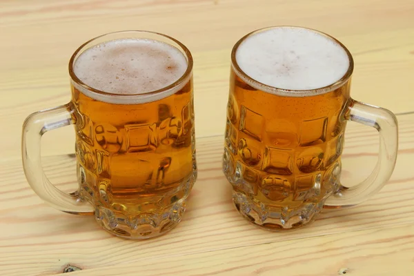 Mug of light beer on the table