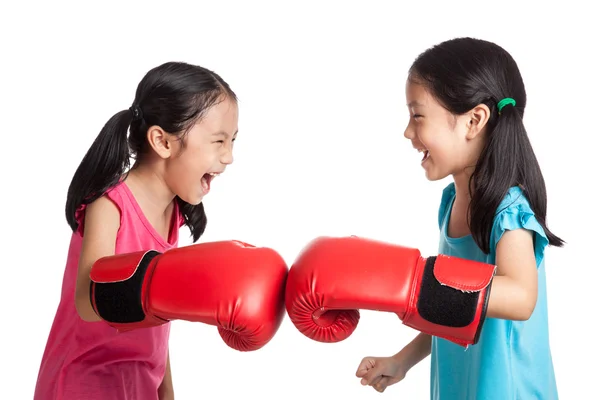 Happy Asian twins girls  with boxing gloves