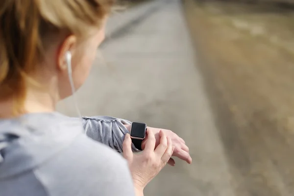 Watch for sports with smartwatch. Jogging training for marathon.