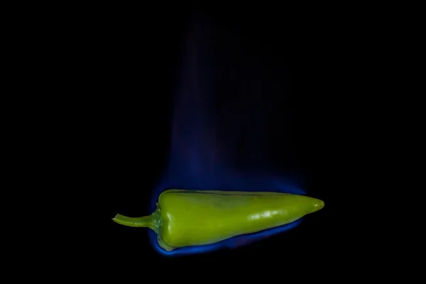 Green pepper on fire