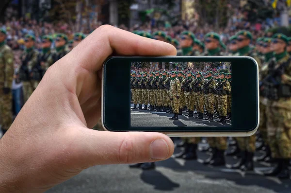 Military detachment, the soldiers standing in formation. phone in hand man. photos from your , Self, photographing on the