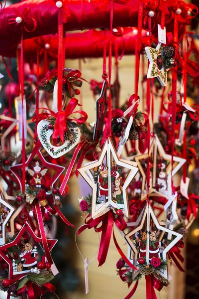 Realistic Christmas decoration hanging with red ribbon