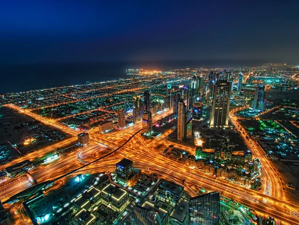 Amazing night skyscrapers at the Sheikh Zayed Road in Dubai, United Arab Emirates