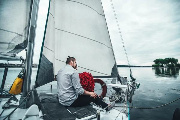 Pretty couple outdoor  relaxing on the yacht