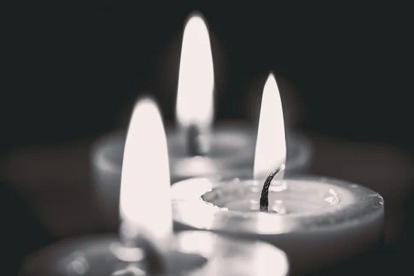 Closeup of burning candle, black and white