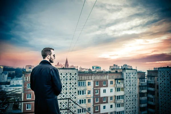 Man on the roof of the high building