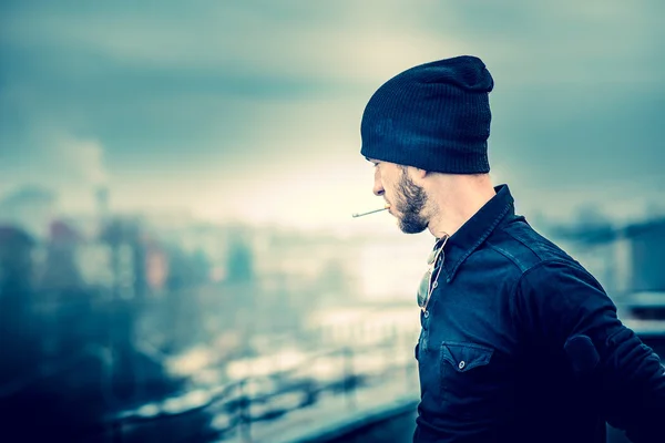 Man on the roof of the high building