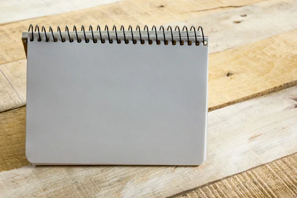 White blank paper notepad book at office worplace. Copy space