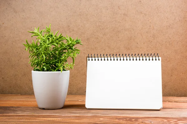 White blank paper notepad book at office worplace. Copy space