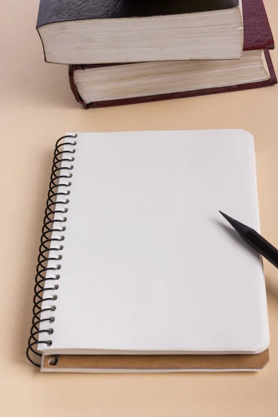 White blank paper notepad book at office worplace. Copy space