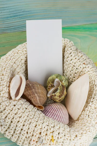 Business card, summer sea vacation mockup background. Notebook blank page with Travel items on blue green wooden table. Sea shells, pebbles, top view.