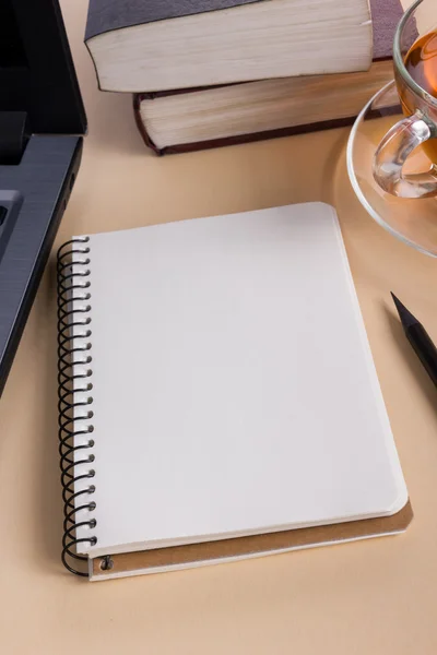 White blank paper notepad book at office worplace. Copy space