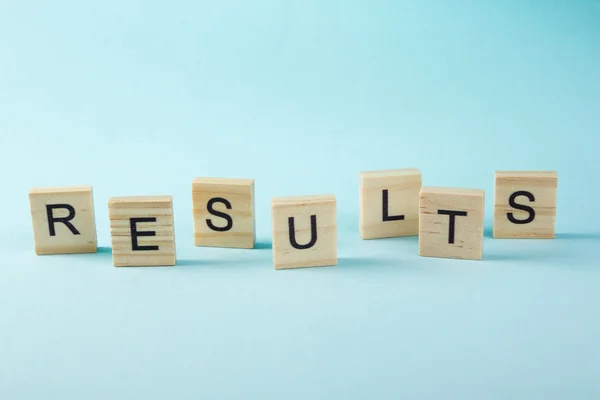 Results word on blue. Succeed business success, be a winner in  elections, pop poll or sports test,  report, election result. Counting losses and profit, analyzing financial statistics