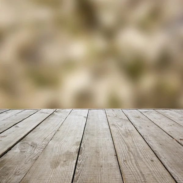 Wooden perspective floor with planks on blurred summer background