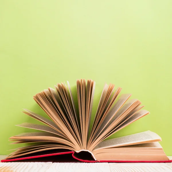 Composition with vintage old hardback books, diary, fanned pages