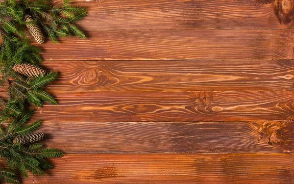 Christmas rustic background - vintage planked wood with Christmas fir tree and free text space.