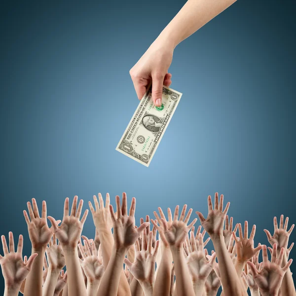Female hand holding money dollars offering them many hands reaching out for earning money. Rich and poor concept. Competition in the labor job market. Line for unemployment benefits Blue background