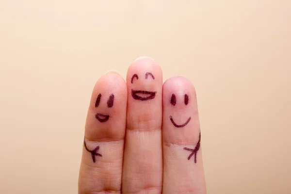 Three smiling fingers that are very happy to be friends