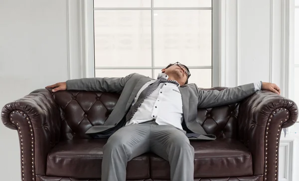 Businessman exhausted and tired.