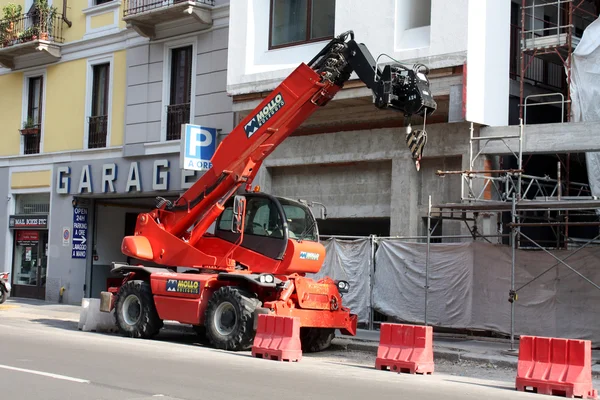 MILAN, ITALY-MAY 25, 2015: Parked red Construction Crane on building site