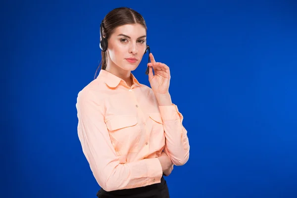 Woman with a headset and a credit card