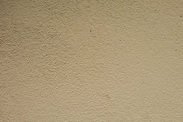 Cream cement wall texture background.