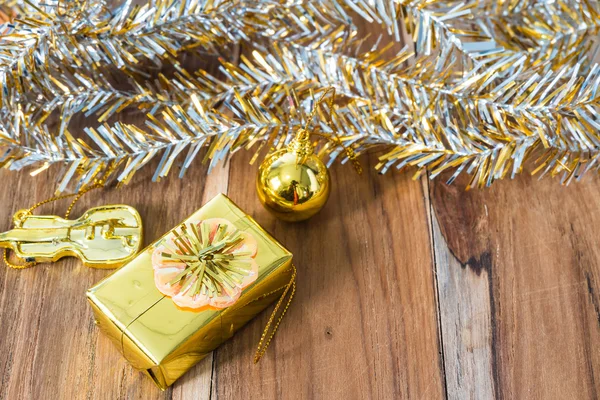 Golden Christmas and New Year decoration on the wooden floor.