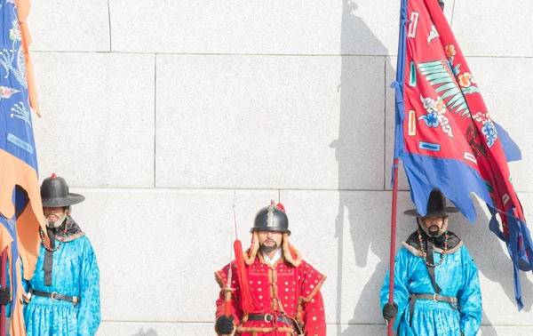 Men in Korean soldier costume around Gyeongbokgung palace    in