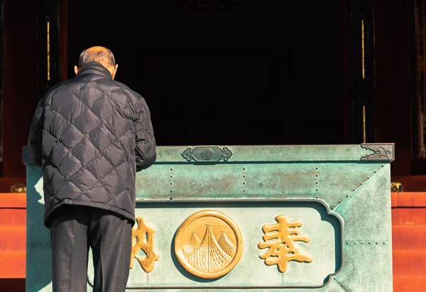 Old man  pray at sensoji temple