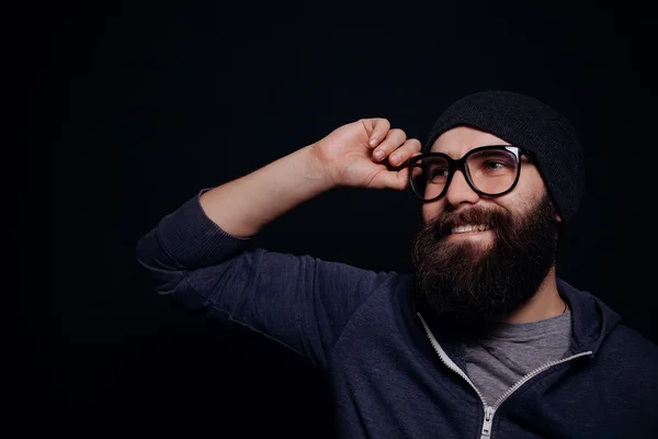 Handsome male big beard in glasses and hat